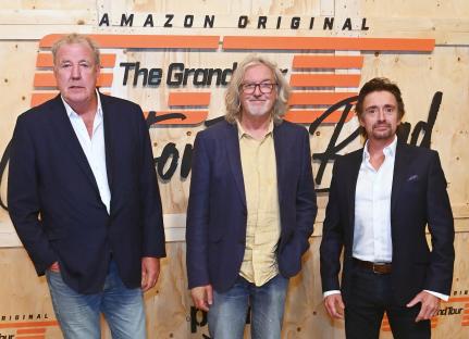 Jeremy Clarkson, James May, and Richard Hammond at a Grand Tour event.