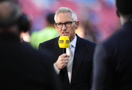 Gary Lineker holding a BBC Sport microphone.
