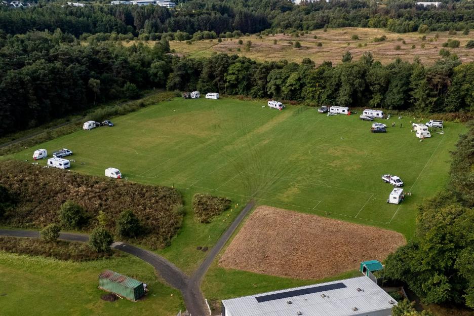 Fury as ‘flytipping’ travellers in 12 caravans take over kids’ football pitch, ‘wee in trees and churn up grass’