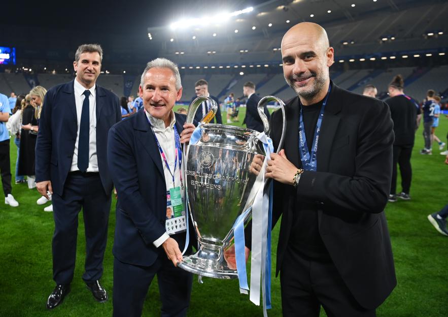 Manchester City director of football Txiki Begiristain and manager Pep Guardiola with the Champions League trophy.