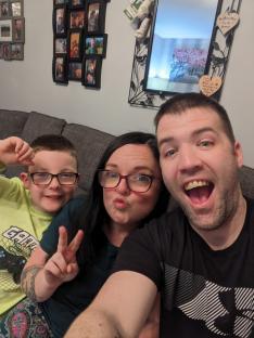 A woman and man with their son.