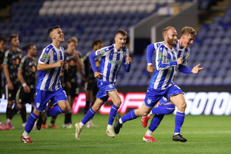 Sheffield Wednesday players celebrating a penalty shootout win.