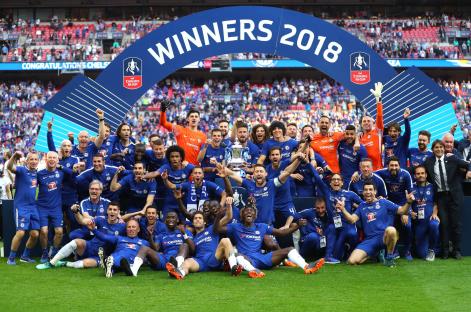 Chelsea team and staff with the Emirates FA Cup trophy after their victory.