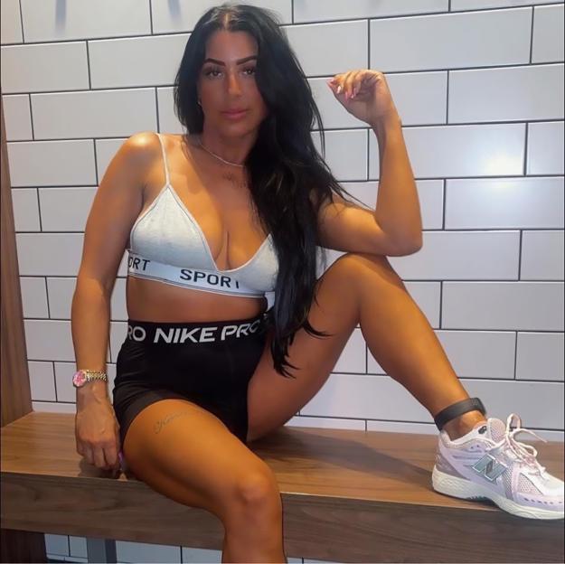 Simone Reed, former Big Brother contestant, wearing athletic clothing and an ankle monitor.