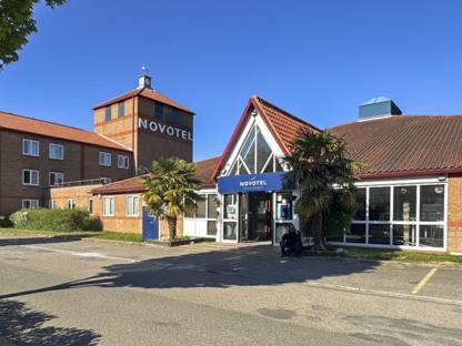Exterior view of a Novotel hotel used to house refugees.