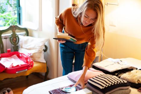 The simple packing method which will fit ‘27 outfits’ into hand luggage – perfect for both sunny and rainy days