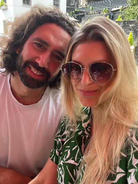 Photo of two people smiling for a selfie.