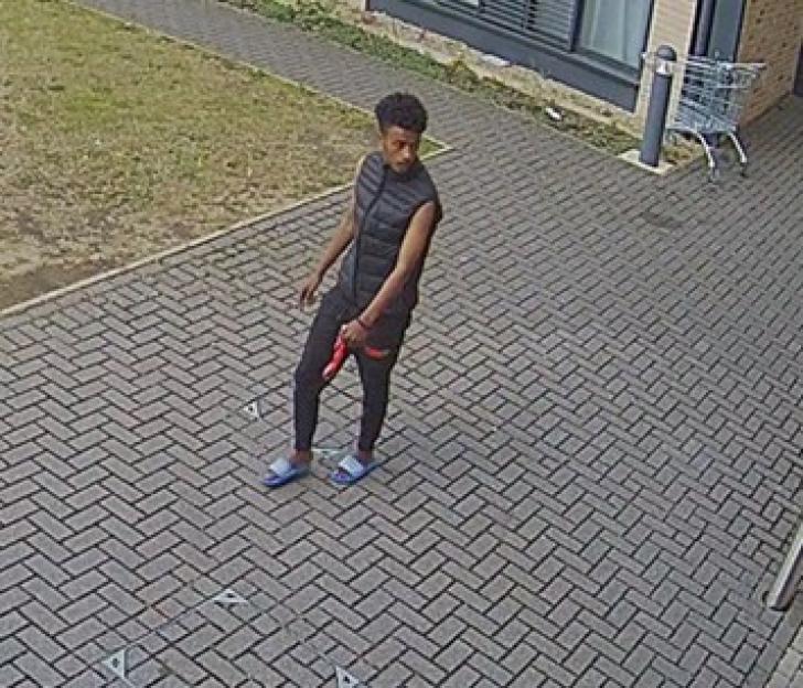 Surveillance image of a man police wish to speak to regarding an attempted murder.