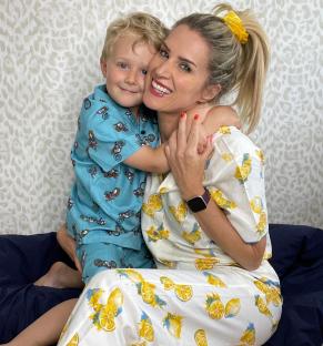 Woman and child in matching pajamas.