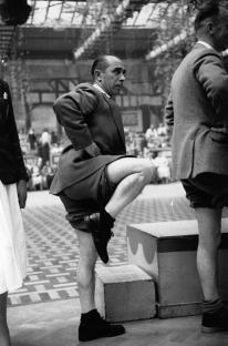 A man participating in a knobbly knees contest.