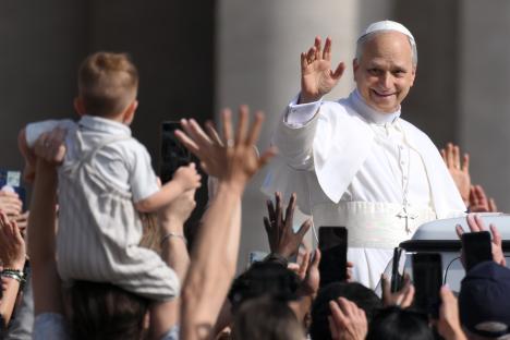 Pope Leo XIV waving to an audience.