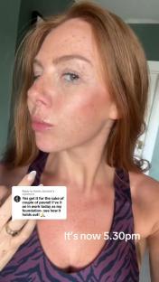 Woman testing makeup foundation.