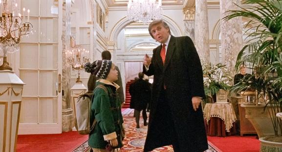 Still from Home Alone 2: Lost in New York showing Kevin McCallister and Donald Trump in a hotel.