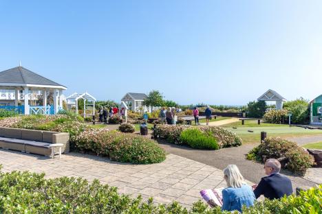 Gardens and lawn bowling green at a resort.