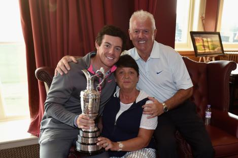 Rory McIlroy with his parents and the Claret Jug.