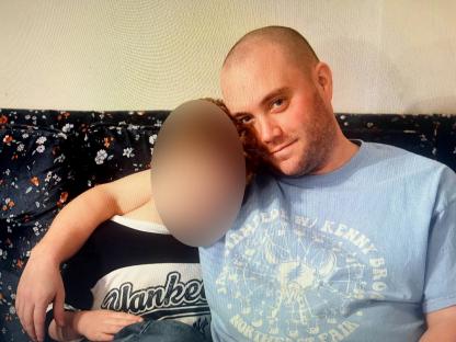 Photo of Timothy McGoff with his son.