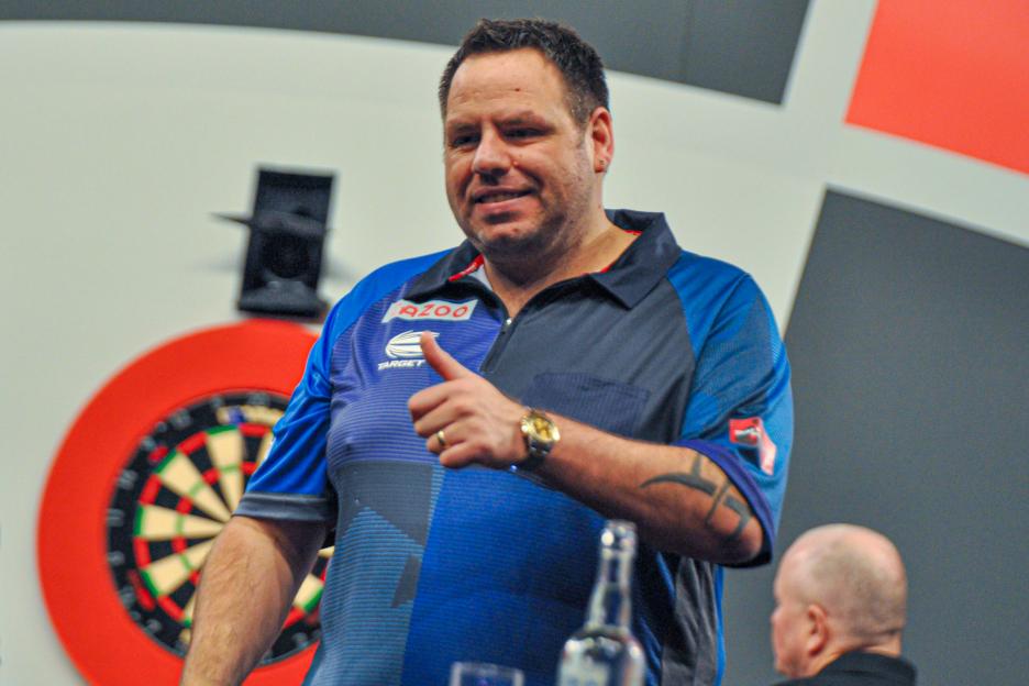 Adrian Lewis of England gives a thumbs up to fans at the PDC World Darts Championship.