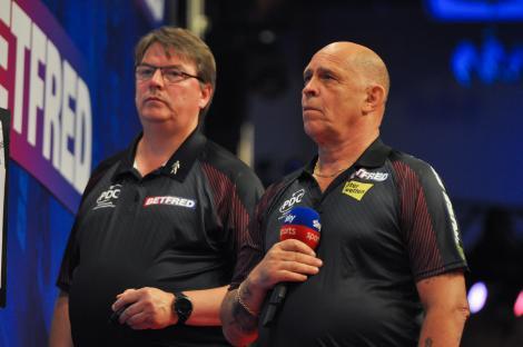 Russ Bray and another man at a darts event.
