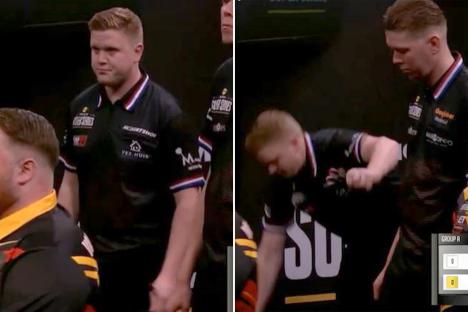 Moment darts star awkwardly falls off stage moments after superb checkout as rivals break out in laughter