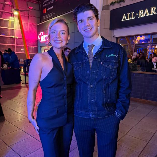 Photo of a man and woman posing together.