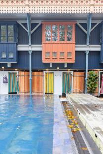 Outdoor pool with changing rooms.