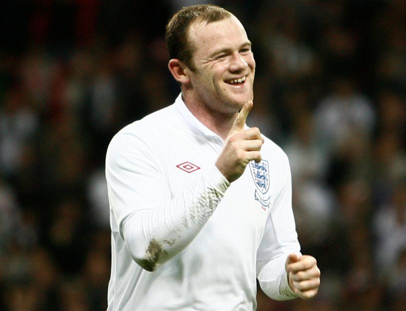 Wayne Rooney celebrating after scoring a goal.