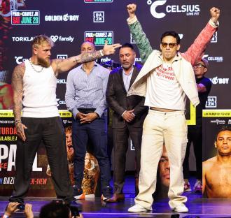 Jake Paul and Julio Cesar Chavez Jr. at a press conference.