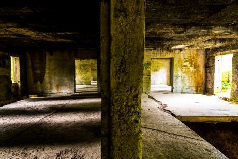 Interior of a dilapidated concrete building.