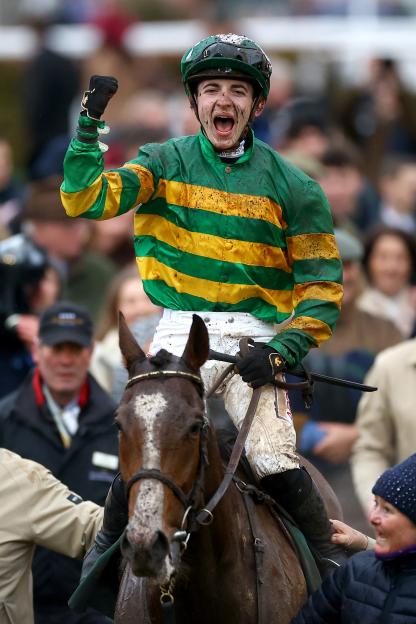 John Gleeson celebrates winning a horse race.
