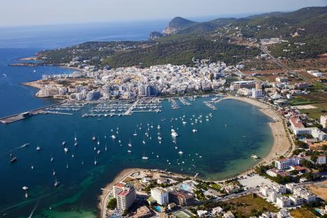Aerial view of Sant Antoni de Portmany, Ibiza, showing the harbor and Playa de San Antonio.