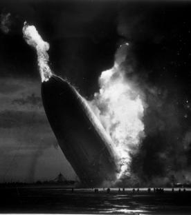 The Hindenburg zeppelin crashing in flames.