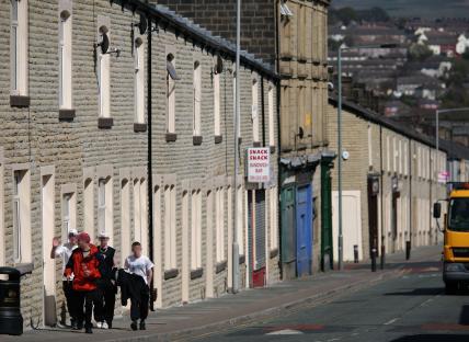 A group of boys walking down a street in Burnley, Lancashire.