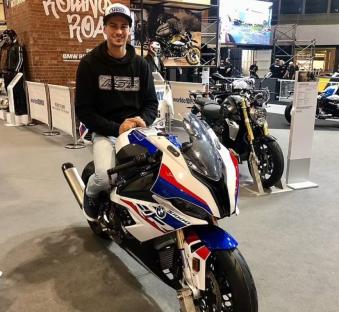 Owen Jenner and Shane Richardson with a BMW S1000RR motorcycle.