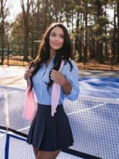 Rachel Stuhlmann on a tennis court.