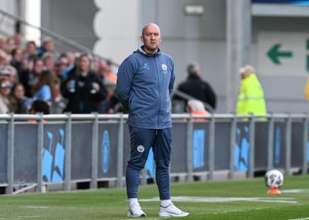 Nick Cushing, interim manager of Manchester City Women, at a soccer match.