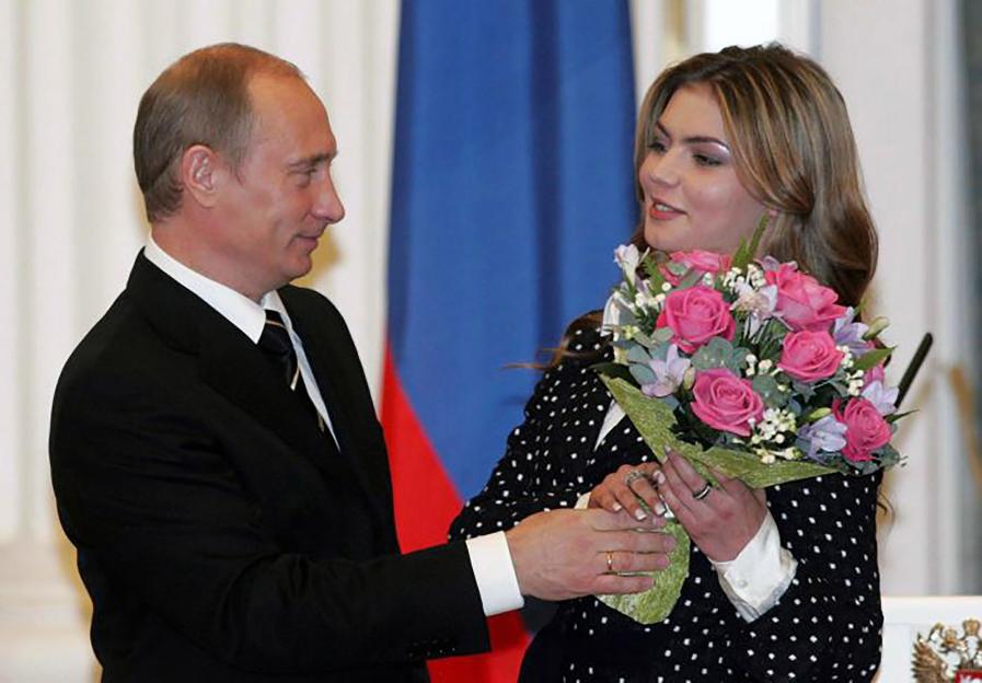 Vladimir Putin and Alina Kabaeva at an event.