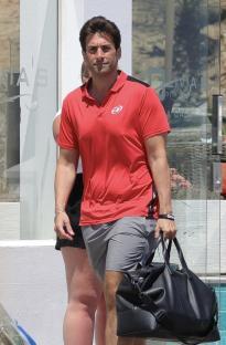 James Argent carrying a bag outside a restaurant.