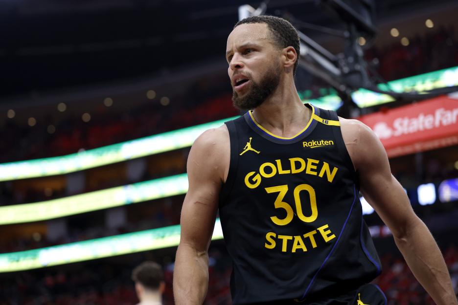 Stephen Curry #30 of the Golden State Warriors reacts during a game.