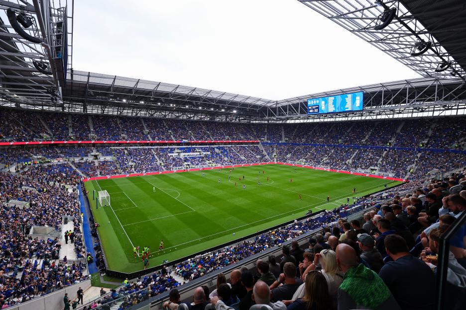 A soccer match in a crowded stadium.