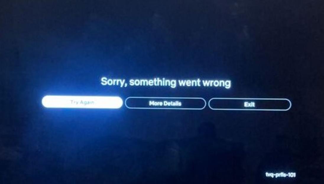 TV screen displaying an error message and balloons on the floor.