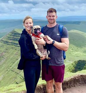Jade Damarell and her husband James with their dog.