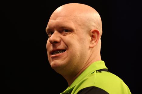 Michael van Gerwen reacting during a darts match.