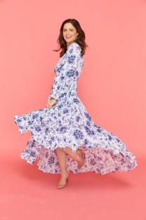 Deborah James in a blue and white floral dress.