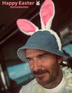 David Beckham wearing bunny ears and a hat.
