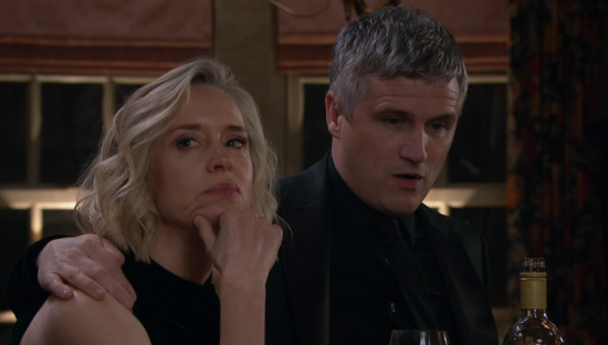 Screenshot of a man and woman sitting together, the woman looking concerned.