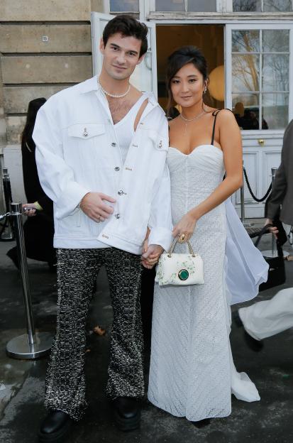 Paul Forman and Ashley Park at the Giambattista Valli show during Paris Fashion Week.