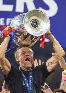 Luis Enrique, PSG manager, lifting the UEFA Champions League trophy.