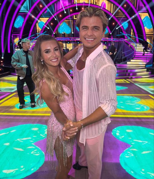 Nikita Kuzmin and Dani Dyer posing together on the set of Strictly Come Dancing.