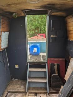 Interior of a narrowboat under renovation.