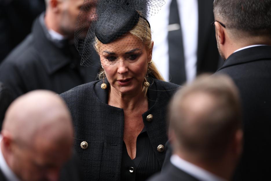 Claire Sweeney, British actor and former partner of Ricky Hatton, wearing a black hat with a veil and a black jacket at Hatton's funeral.
